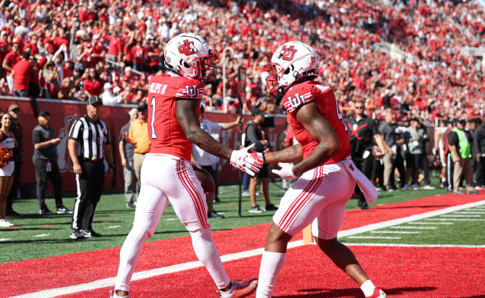 Utah Utes cornerback Clark Phillips III (1) shakes hands with cornerback JaTravis Broughton (4) after making his third interception of the game against the Oregon State Beavers at Rice-Eccles Stadium.